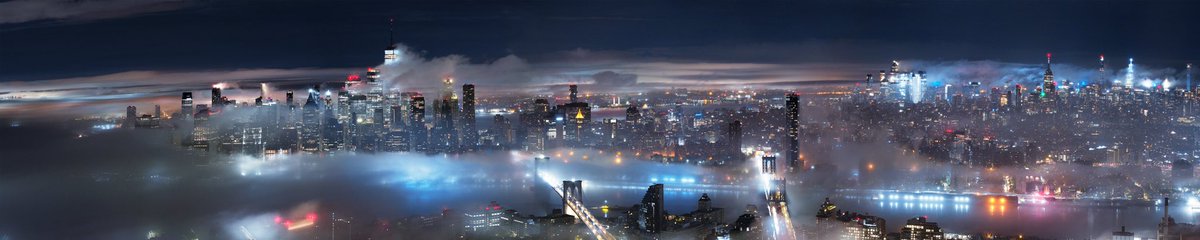 New York City cutting a blanket of fog