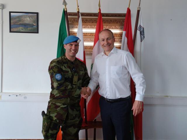 TipperaryGAA's tweet photo. From FBD Semple Stadium to Lebanon
Deputy Commanding Officer 120 Inf Bn Comdt Murtagh Brennan from @Loughmore_Gaa greets An Taoiseach Micháel Martin during his visit to Irish troops in South Lebanon on May 29th. Murtagh was S&amp;C coach to the 2021 Double Co Senior Champions. https://t.co/h5cH4OHMa7
