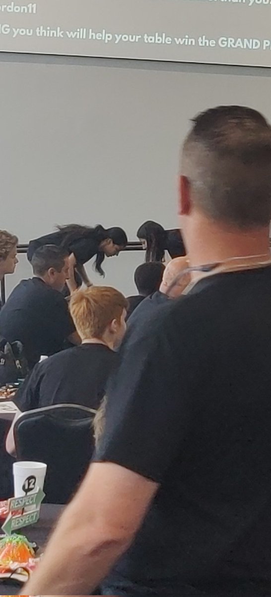 Alondra and Bianca in a post- lunch head shoulders knees toes battle!

Table I'm feeling 22. 
#leadaisd
@MackeySpeaks 
<a href="/alvinisdath/">Alvin ISD Athletics</a>