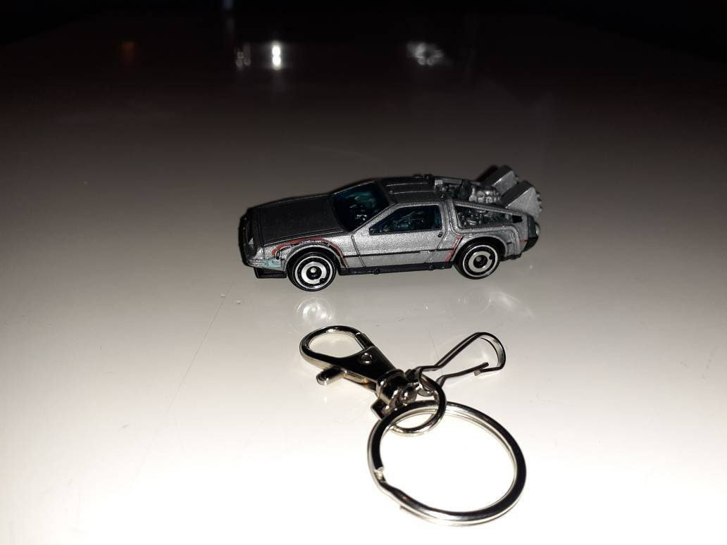 Nostalgia1976's tweet photo. Excited to share the latest addition to my #etsy shop: Key fob charm custom keychain w/Hot Wheels Back to the Future Delorean Time Machine #giftsforhim #giftsfordad #nostalgicgifts  #handmadegifts #deloreankeychain #Backtothefuture https://t.co/EewZzR4IT5 https://t.co/mVKrVEliMt