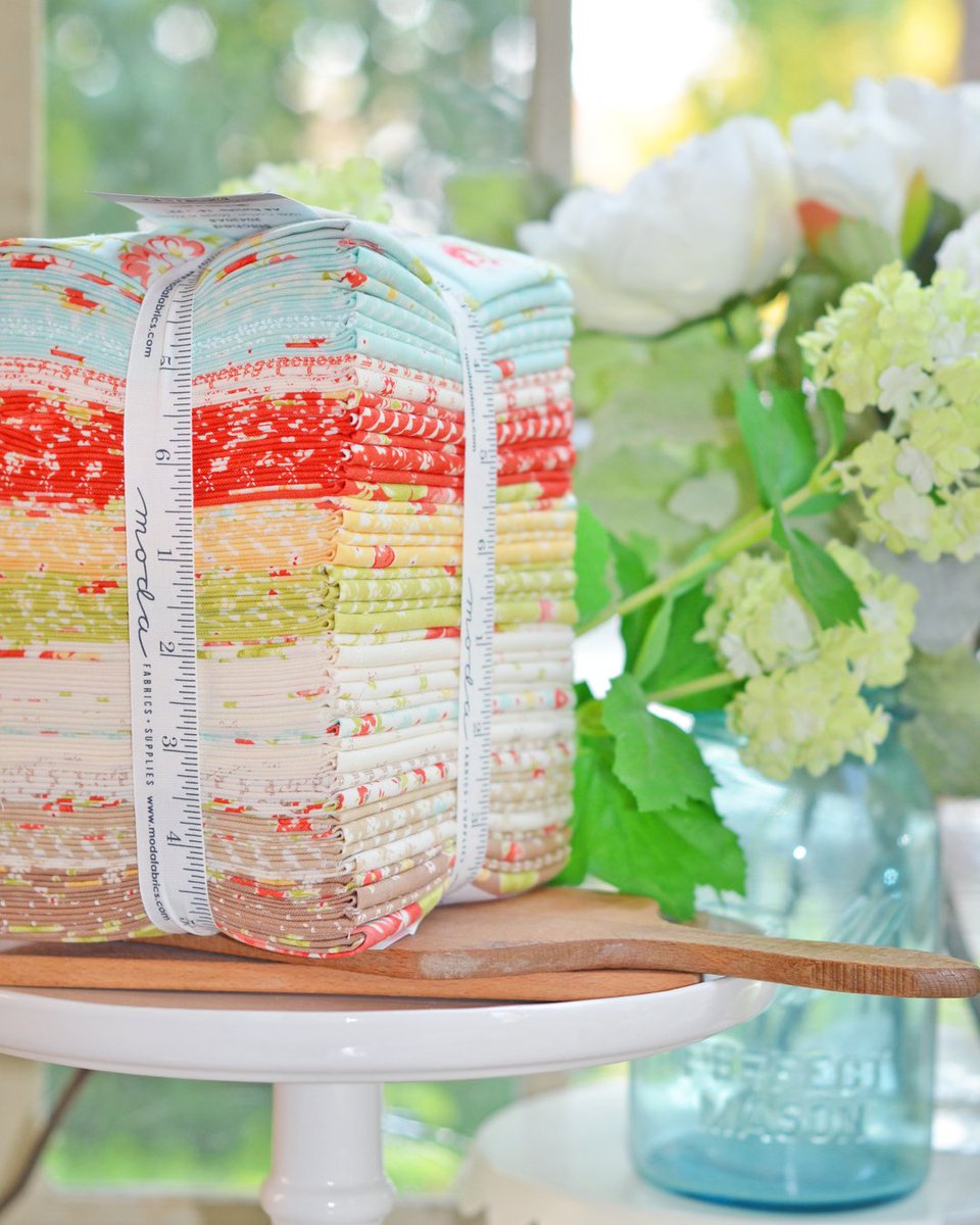 From the aqua and yellow to taupe and cream, the color palette of Stitched by Fig Tree &amp; Co. echoes the feel of those perfect warm summer days where you can relax on the porch with a glass of cold iced tea and watch the world go by.

Stitched is in stores now, and is the perfect