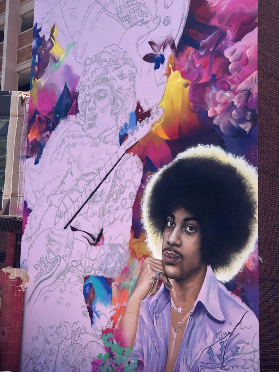 MeetMinneapolis's tweet photo. Downtown Minneapolis is getting a new Prince mural - and just in time for this week's Celebration! 🎨 💜 The mural can be found on the Ramp A parking garage of North First Avenue, just steps away from @FirstAvenue nightclub. Prince forever! #prince #minneapolis #princeforever💜🕊 https://t.co/2c976U5Wxn