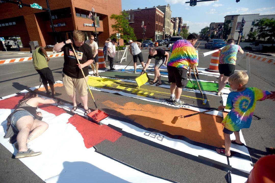The intersection of South Main and East Main Cross streets is a lot more colorful thanks to a group of about 20 volunteers from LGBTQ+ Spectrum of Findlay.