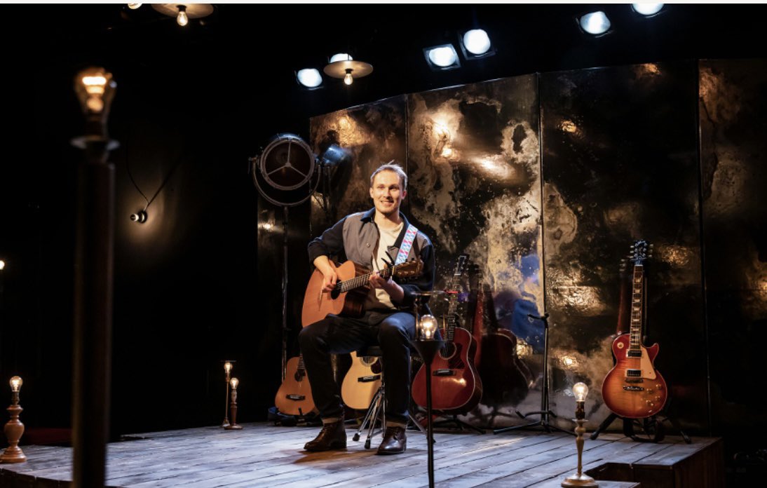 But this production also captures the changing moods of the show with effortless shifts of register, as <a href="/maxalextaylor/">Max Alexander-Taylor</a> daringly connects eye to eye with audience members, and swaps guitars for different sounds.