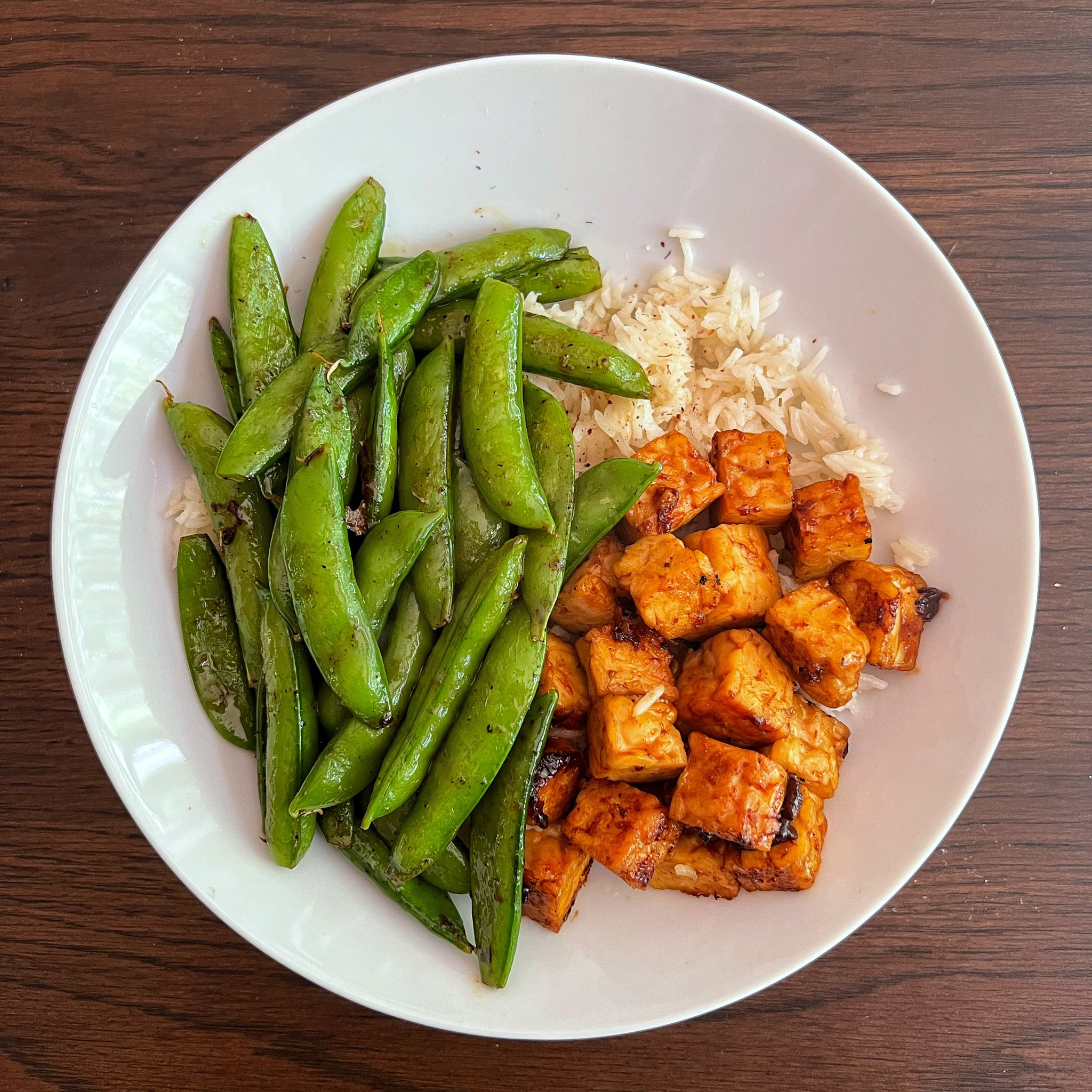 Nimai Delgado on X: "Lazy vegan meal prep with ~27g protein. Smoky BBQ  tempeh with rice and snap peas. https://t.co/fjX1VX6RKY" / X