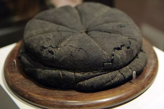 2000-year-old preserved loaf of bread found in the ruins of Pompeii.