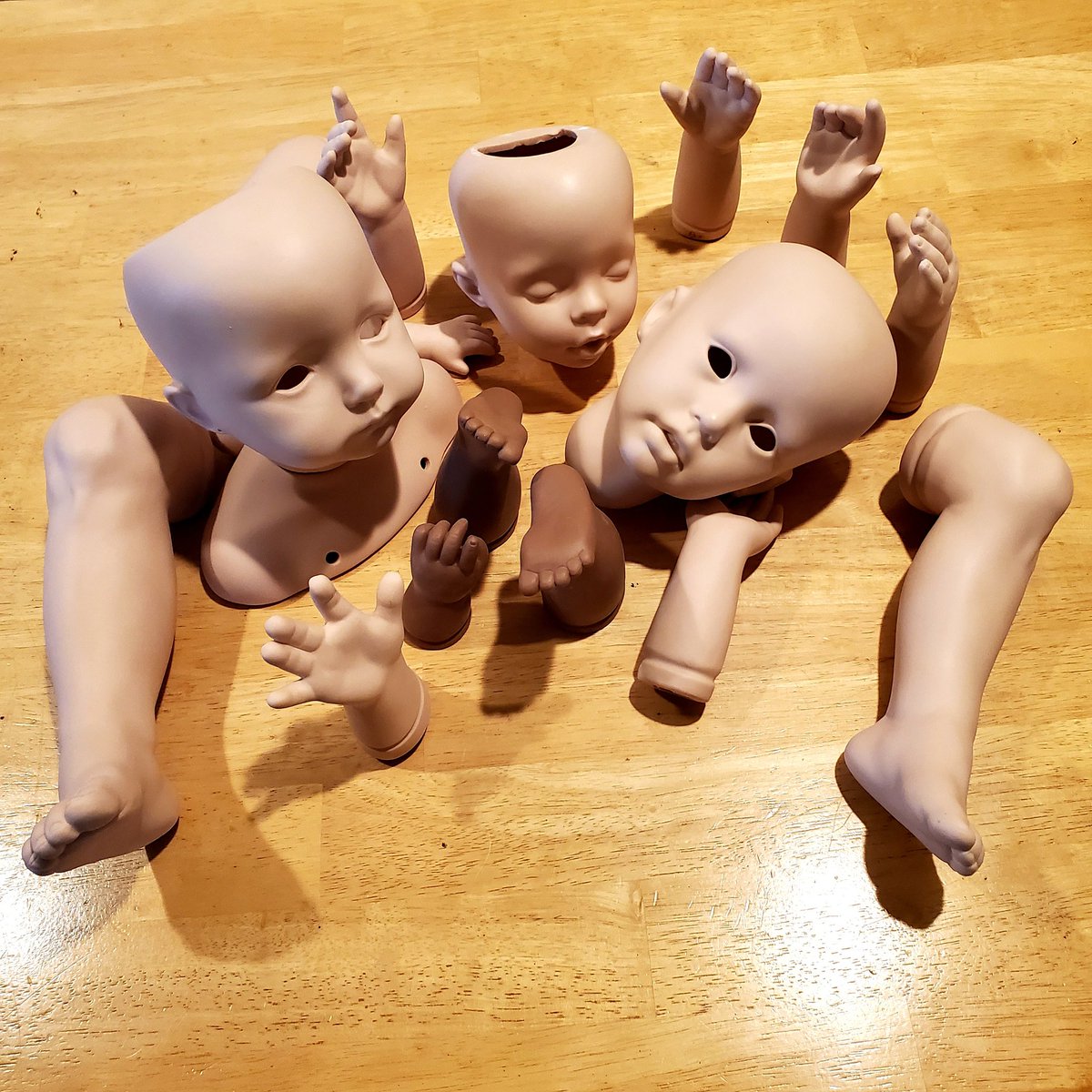 FionaStuff's tweet photo. Random ceramic baby parts I found at Goodwill last week pretty much sum up my current feelings about the good old USA. https://t.co/ebQgLVODvi