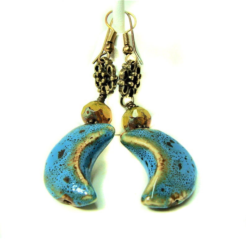 girliegals12's tweet photo. Blue Porcelain Crescent Moon Earrings w Yellow Picasso Czech Crystal Rondelles: https://t.co/pEzHDyI1b9... #moonjewelry #crescentmoon #dangleearrings #blueporcelain #crystalrondelles #yellowczechcrystals #celestial #antiquegoldjewelery #giftforher #handmadeatamazon #amazonjewelry https://t.co/37KTN8lQmv