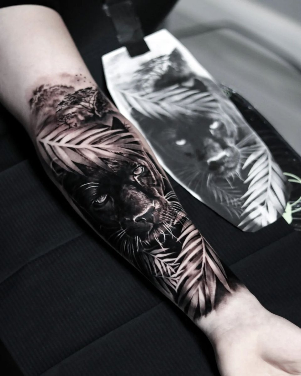 Black and grey panther tattoo on the right inner