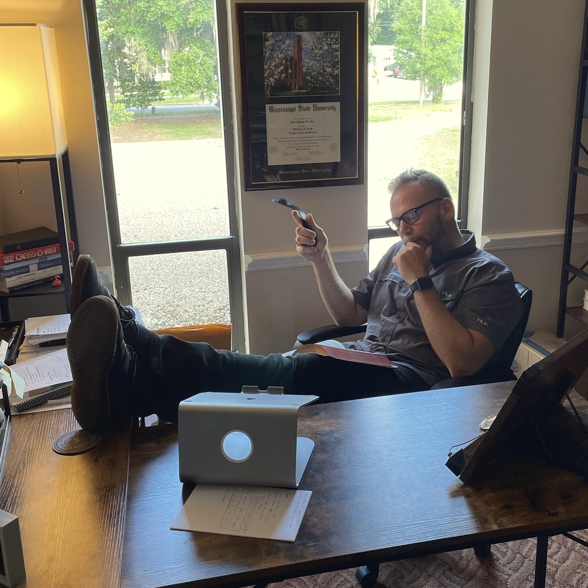 Hey, <a href="/calebbrasher/">Caleb Brasher</a> do you know what you do when your friend is on vacation? You raid his office, of course. 🤣 Nice desk.