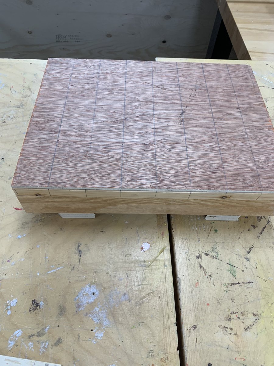 Grade 7/8 Ss working on building their scaled down cabins from the blueprints they designed themselves