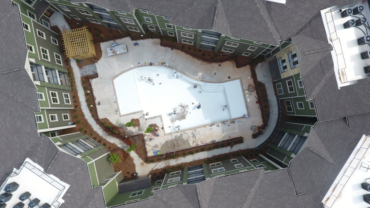 Van_WinkleCo's tweet photo. Excited for move-in day soon? Shiloh Road Apartments near @kennesawstate in @cityofkennesaw looks lusher by the minute as landscaping takes root and the pool is in a just-add-water state! #construction #constructionmanagement #multifamily #apartments #pool #studenthousing https://t.co/QLpXefIRUi