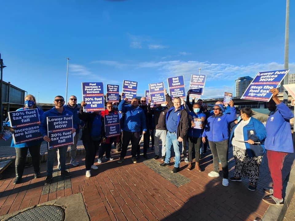 Our_DA's tweet photo. The DA is out interacting with residents in NMB regarding the impact of today’s fuel price hike.

DA Shadow Minister of Mineral Resources and Energy, @kmileham, is rallying citizens to join our fight to scrap fuel taxes.

Visit https://t.co/qbfu60wvW3

#SlashFuelPrices https://t.co/LIKOp7GB2z