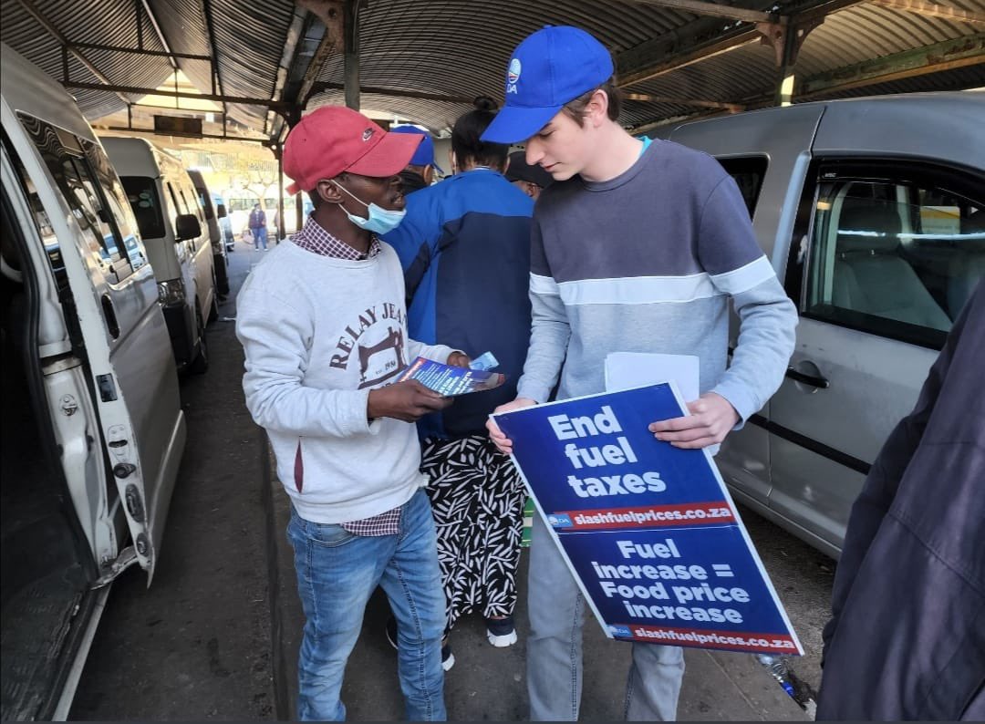 Our_DA's tweet photo. The DA is out interacting with residents in NMB regarding the impact of today’s fuel price hike.

DA Shadow Minister of Mineral Resources and Energy, @kmileham, is rallying citizens to join our fight to scrap fuel taxes.

Visit https://t.co/qbfu60wvW3

#SlashFuelPrices https://t.co/LIKOp7GB2z