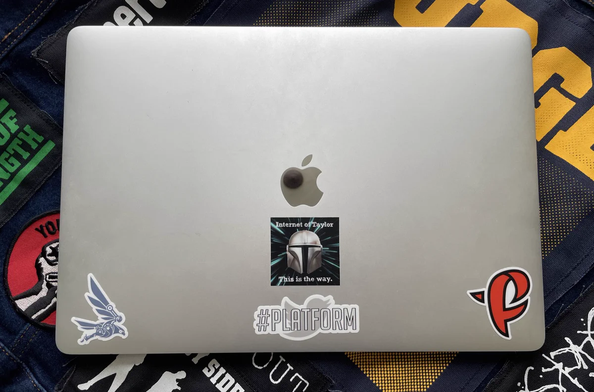 A Twitter Mac laptop atop a GDPR jean jacket modified with hardcore band patches. The title of “Hardcore Engineer” at Twitter has always been mine.