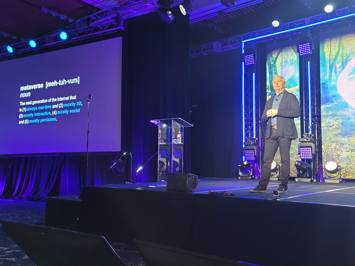 nathanc's tweet photo. Breaking down the word #Metaverse with @johnriccitiello from @unity. While there's little agreement, he's taking a stance on: real-time, mostly  3d, mostly  interactive, mostly social, mostly persistent.
@ARealityEvent #AWE2022
#ar #vr https://t.co/NuZhW64CBY