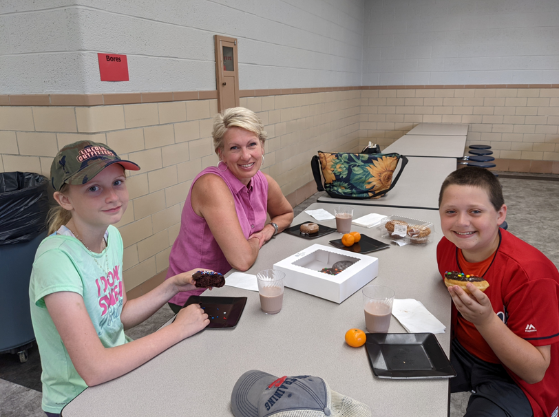 Alia Bogard and Owen Fries enjoyed doughnuts today with Norwalk Catholic's Librarian, Mrs. Ruffing for high achievements in the AR Frequent Flyer Program.