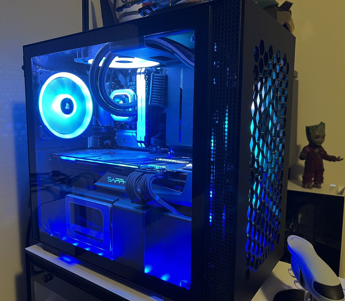 CraigDorsey's tweet photo. Here is my little NZXT H210 with a custom front panel so I could fit my Sapphire Nitro+ RX 5700 XT with a 240mm AIO. I’d love to to win the NZXT H7 Flow in Matte White/ Matte Black. #NZXTSetups https://t.co/FbxsIwFdmw