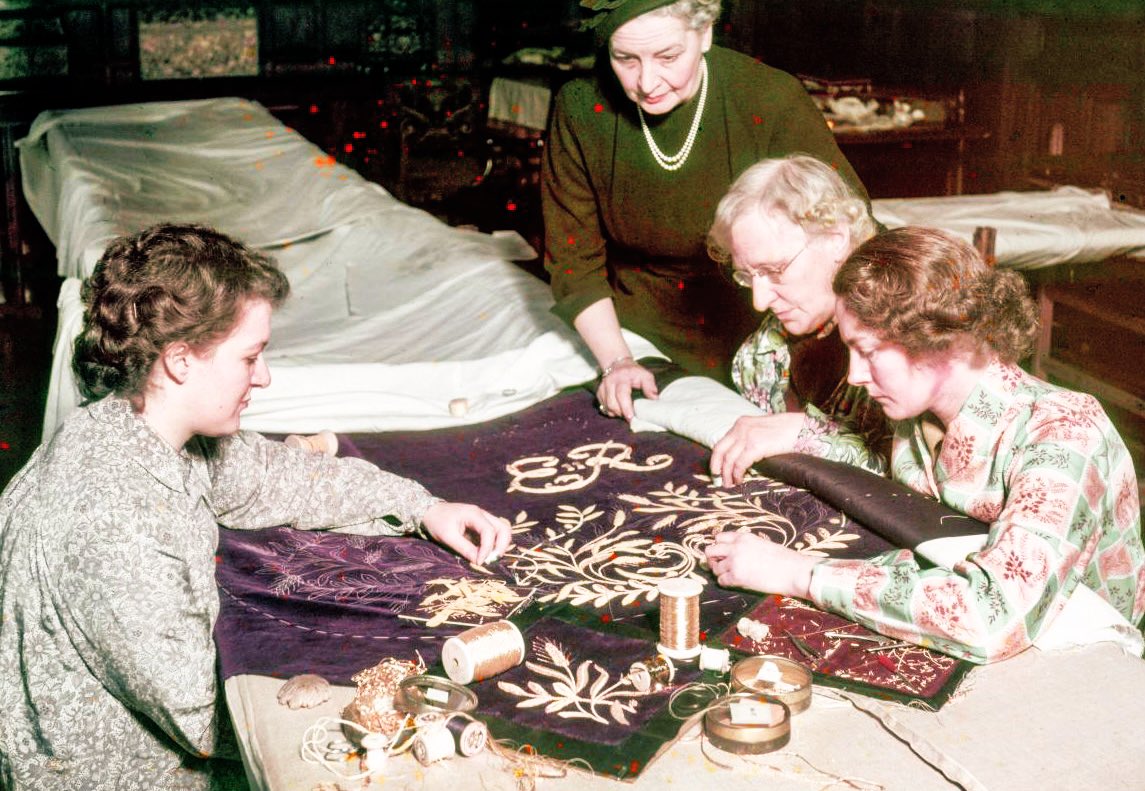 Archive colour photograph of The Queen’s Coronation robe being embroidered <a href="/RoyalNeedlework/">Royal School of Needlework</a>. The design was based on a motif signifying peace and prosperity during her reign