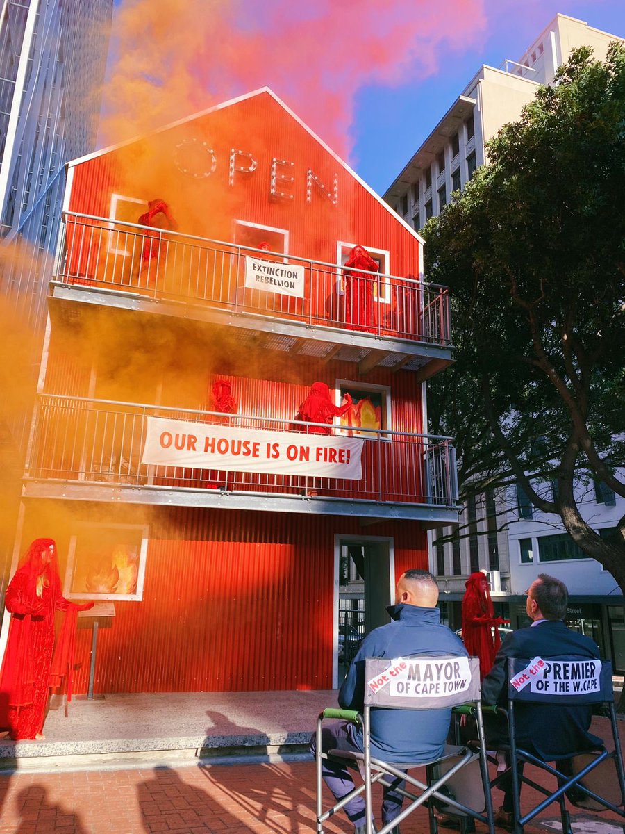 CtxRebellion's tweet photo. Our house is in fire! Earlier today, XR Cape Town handed over demands to Cape Town city representatives to declare a climate and ecological emergency. @CityofCT Act now! 

#RedRebels 
#ClimateCrisis 
#ClimateActionNow
#ClimateEmergency https://t.co/gWRBYkgduB