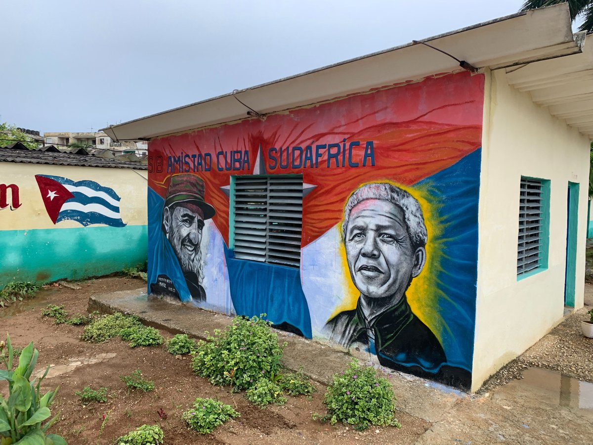 SAEmbCuba's tweet photo. Ambassador Phosa visited the Cuba-South Africa Friendship junior high school just outside Havana to engage with staff &amp; students, committing to return with more information on the history of South Africa &amp; @NelsonMandela on #MandelaDay. @DIRCO_ZA @AMO_icap https://t.co/AaEU3owqvp