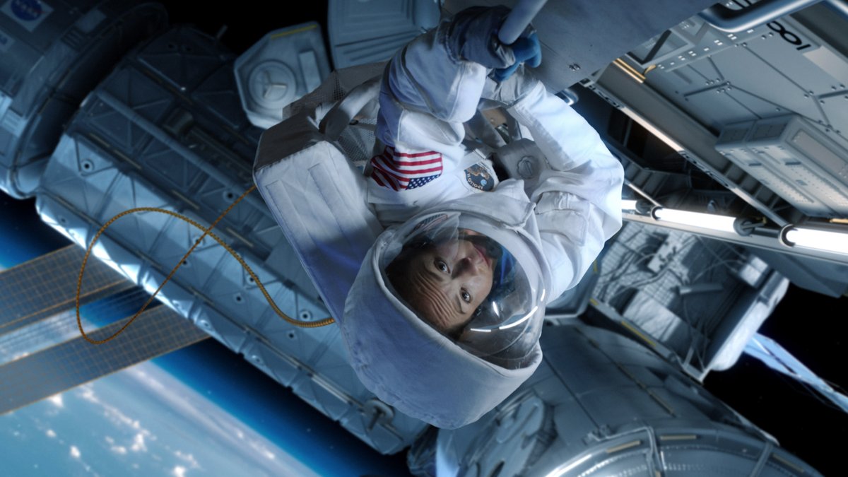 For Astronaut Sarah Hughes' spacewalk, director <a href="/DavidCodeglia/">David Codeglia</a> had actress <a href="/AliciaZiegler/">Alicia Ziegler</a> lay on her side on an office chair pushed by a dude in green spandex. <a href="/MutinyFX/">Mutiny FX</a> did the rest.

Movie magic.