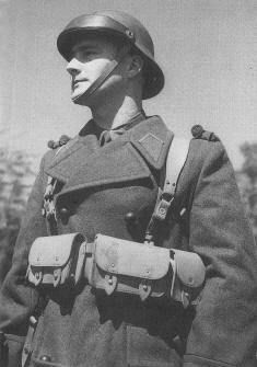 AccAxis's tweet photo. Soldier from Vichy France poses here with an M41 "Jeanne d'Arc" helmet https://t.co/FU0Y4aUjrL