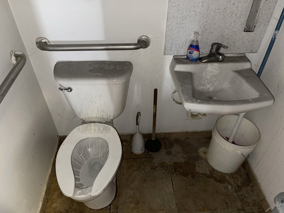 #FireDamageFriday Soot remnants in the bathroom of an office building after a warehouse fire occurred!