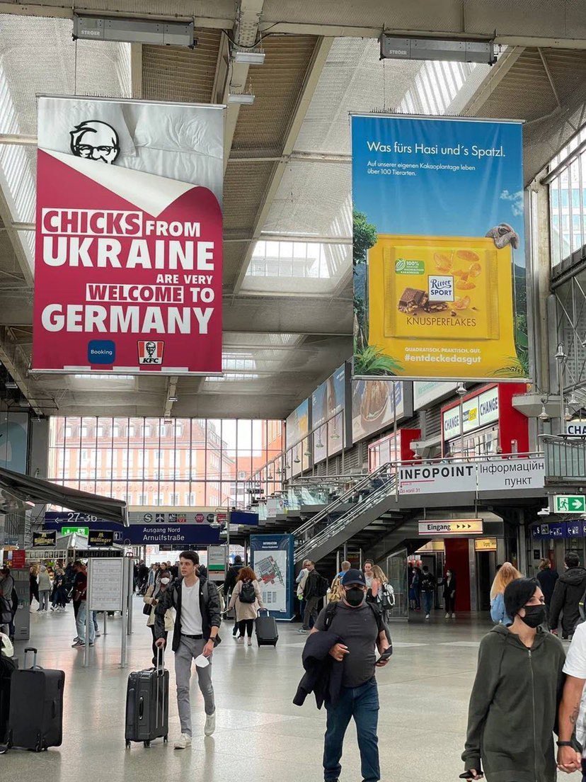 i_gil_'s tweet photo. This is an ad from Berlin station. While 🇺🇦 women an children flee war and getting snatched and human trafficked right from the borders, @bookingcom and @kfc do a “collab” calling them “chicks” and using a cheesy bed visual? Y’all good? How did this get authorised? https://t.co/vra1wm5Aka