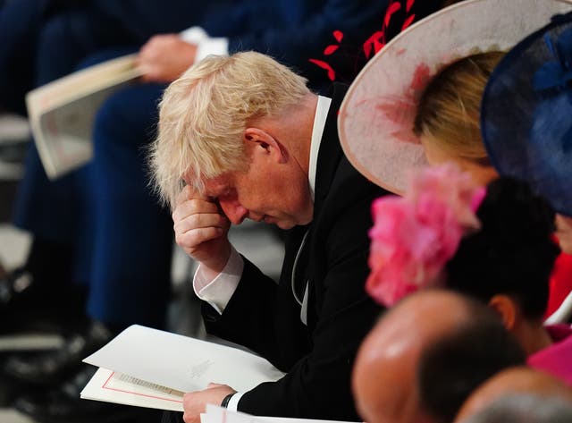 Philsbodydouble's tweet image. These photos taken of Johnson during the service after the boos are a thing of beauty.

He knows. He knows.