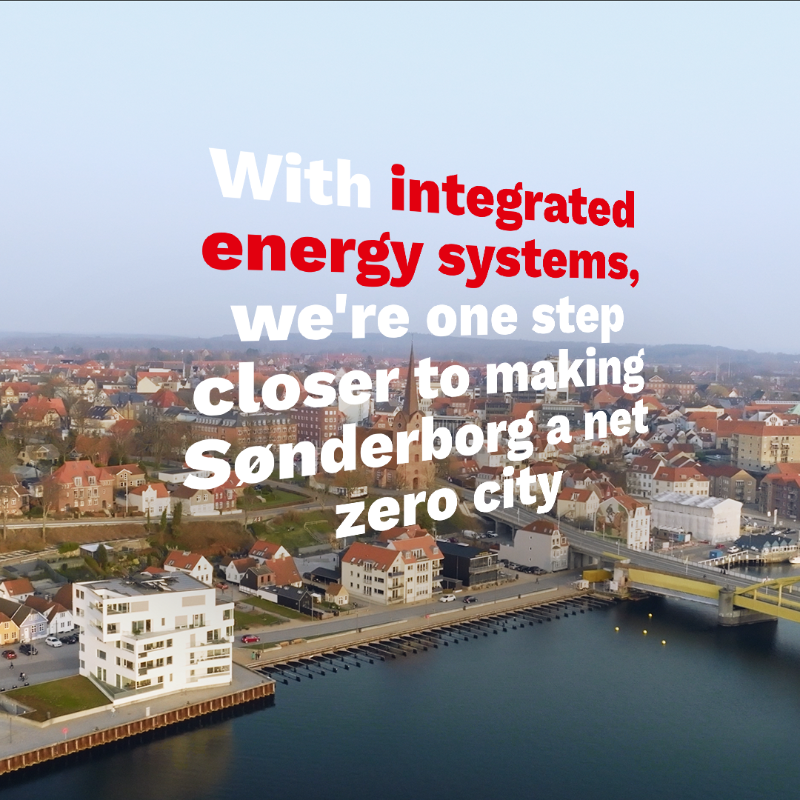 Danfoss's tweet photo. Use the same energy twice: Cooling creates excess heat, so we can use the excess heat from supermarket freezers to heat buildings. It’s just one of the sector integration solutions we’re excited to showcase at the 2022 IEA conference.