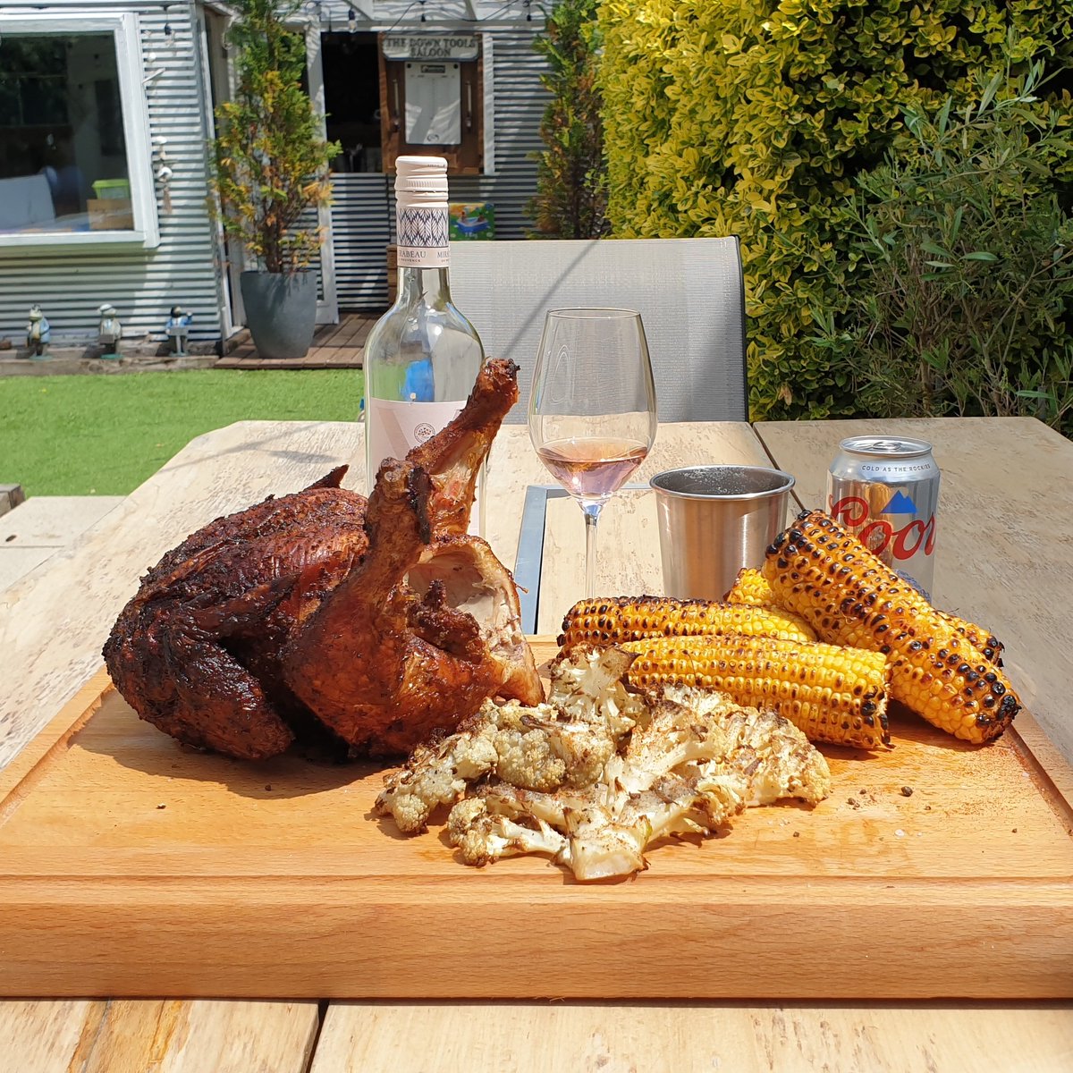 duncanwilkinson's tweet photo. The perfect bank holiday #BBQ: Hickory-smoked, cajun-rubbed, beer can chicken. Smoked paprika and pepper dusted cauliflower. Salt and pepper corn-on-the-cob. Just add alcohol. #BBQLife #Weber #BeerCanChicken #CoorsLight #Mirabeau #BankHoliday https://t.co/tCXoaceOwz