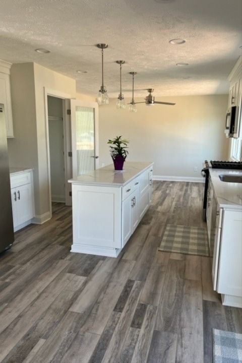 COREtec Plus Enhanced Plank Axial Oak looks absolutely stunning in this customer's kitchen! The variety in tones creates a beautiful shade variation that can really add character to the space. dlvr.it/SRZYcq