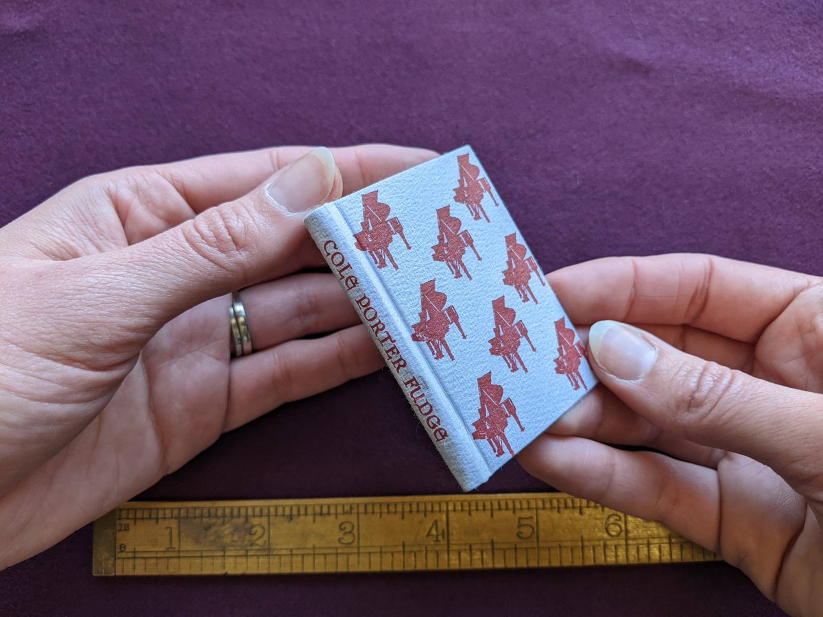 McGill_Rare's tweet photo. Set, printed and bound by author James L. Weygand in Nappanee Indiana for Maestro Books, this #tinybook is an homage to fudge, Cole Porter Fudge to be precise. The #postagestamp portrait is just the right size.
#tinybooktuesday #smallbooks #miniaturebindings #tinybook https://t.co/QrMbtm9i5K