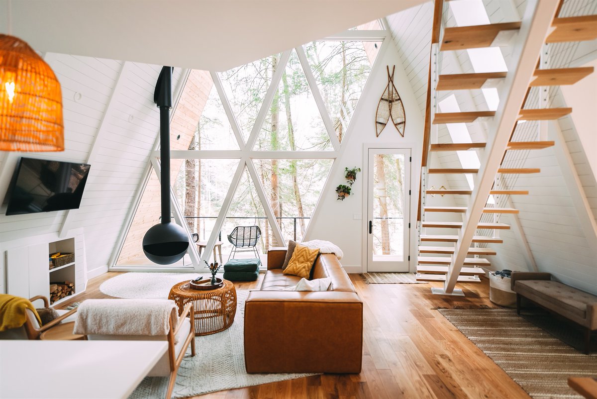 Airbnb's tweet photo. grab your hiking boots... this cabin is nestled in between cliffs, caves and waterfalls 🥾 https://t.co/OqtoTEEMtF