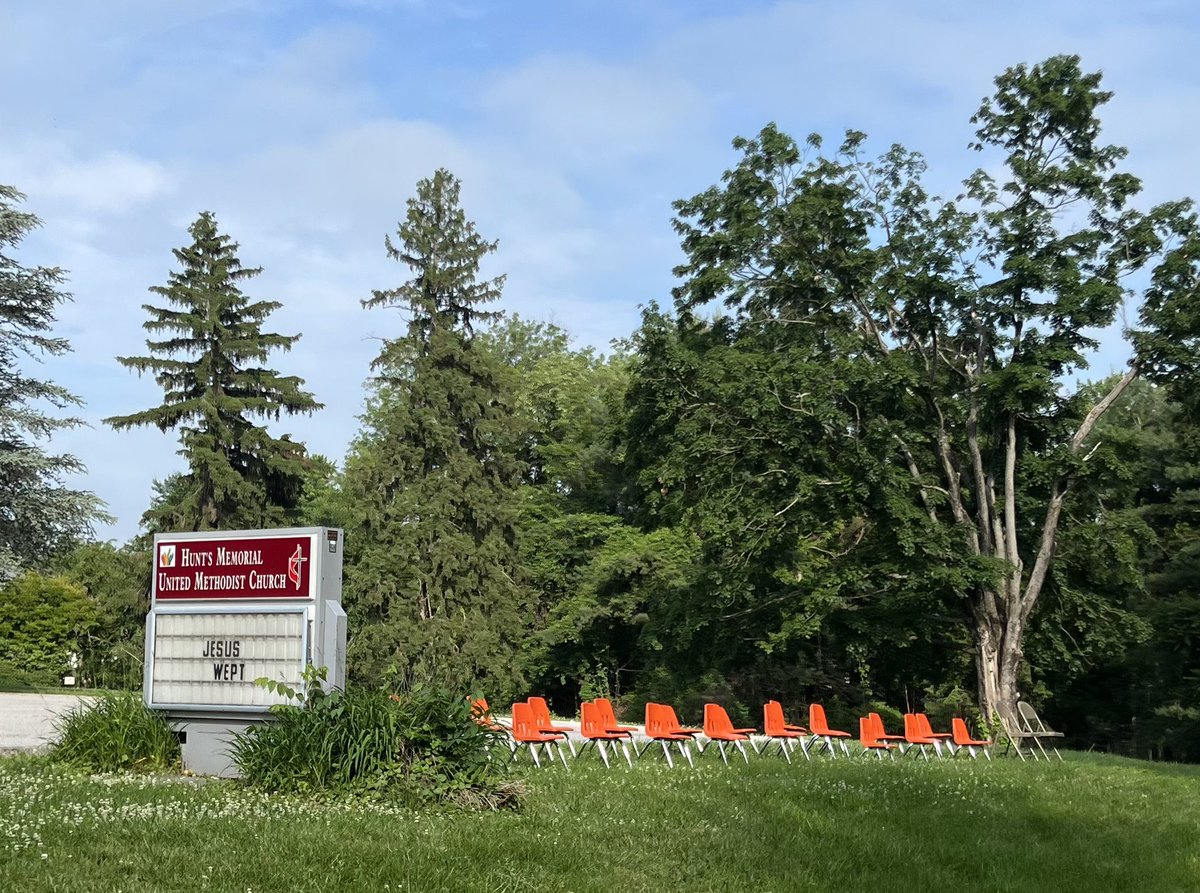 JoyLambert's tweet image. A powerful and heartbreaking image at Hunts Memorial UMC in Towson. I pass these 19 little orange chairs and 2 folding chairs every morning, I haven’t made it yet without crying.