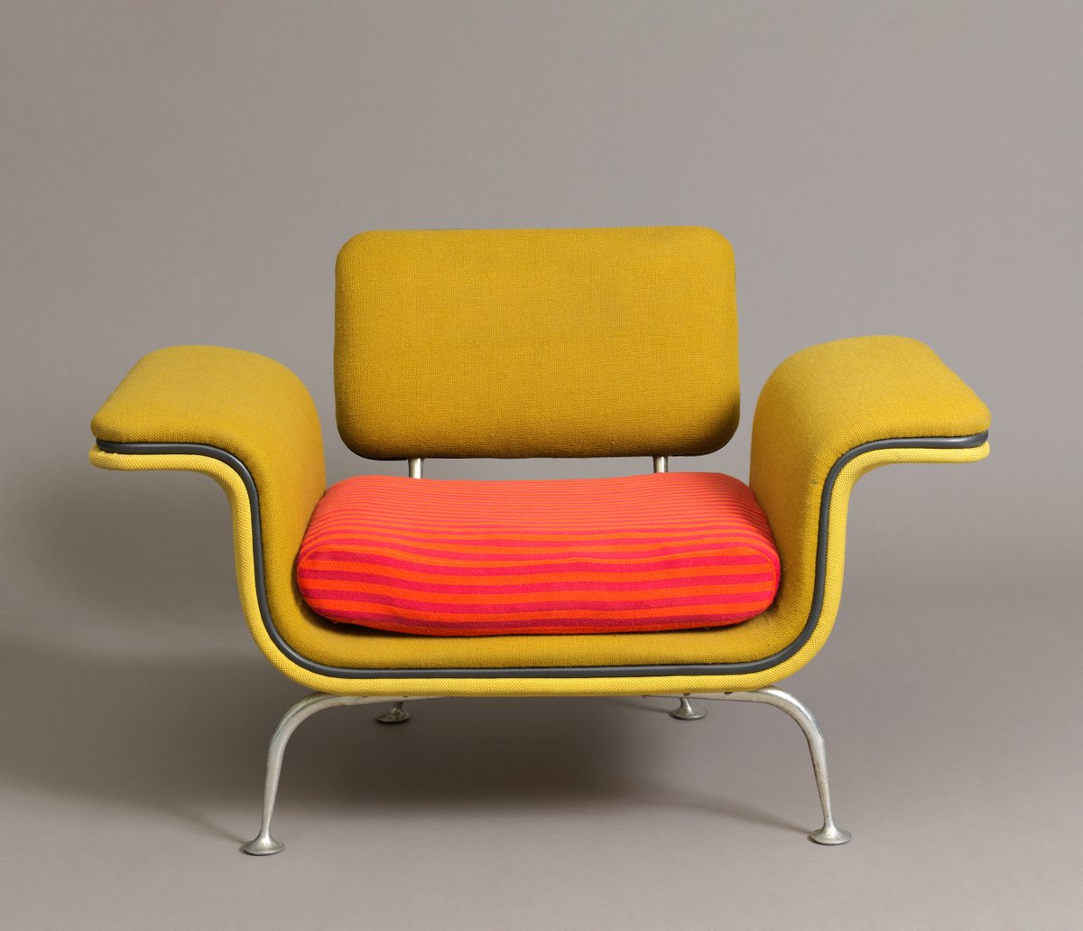 Alexander Girard believed that modernism did not need to be dull or drab—and he certainly proved it with this design! This armchair from 1967 shows his skill for incorporating playfulness into everyday life, even in mundane settings—it was designed for an airport terminal.