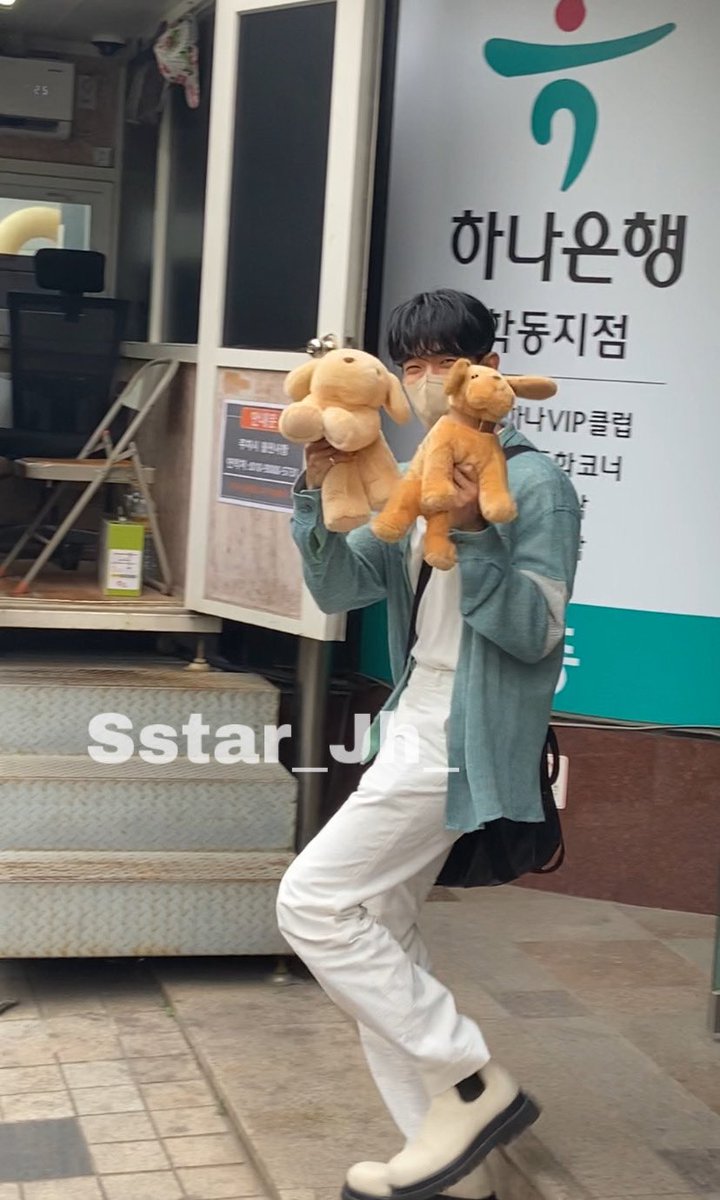 thinkabtsh's tweet image. dokyeom walking out with a puppy in either hand and jeonghan having Weaponry and a Gay Little Iced Coffee