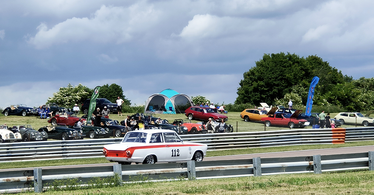 The Lotus Cortina of Neil Brown and Richard Dutton on its way to taking the chequered flag as part of a Lotus Cortina 1-2-3 in today's HRDC 'Jack Sears Trophy' for Touring Cars 1958 - 1966.

<a href="/thruxtonracing/">Thruxton Circuit</a> 
 #thruxtonhistoric #THRUXTON #touringcars #historicmotorsport