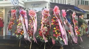 BBC_Mena's tweet photo. Throwback to the time Kyung sent 10 flower wreaths that just said Park Kyung on them to the opening of  Yogorino (the place Zico helped open)...

To new bees.. this is exactly the sort of thing you're missing on by Kyung not being active 😅😂 https://t.co/VGTqYIIt0S