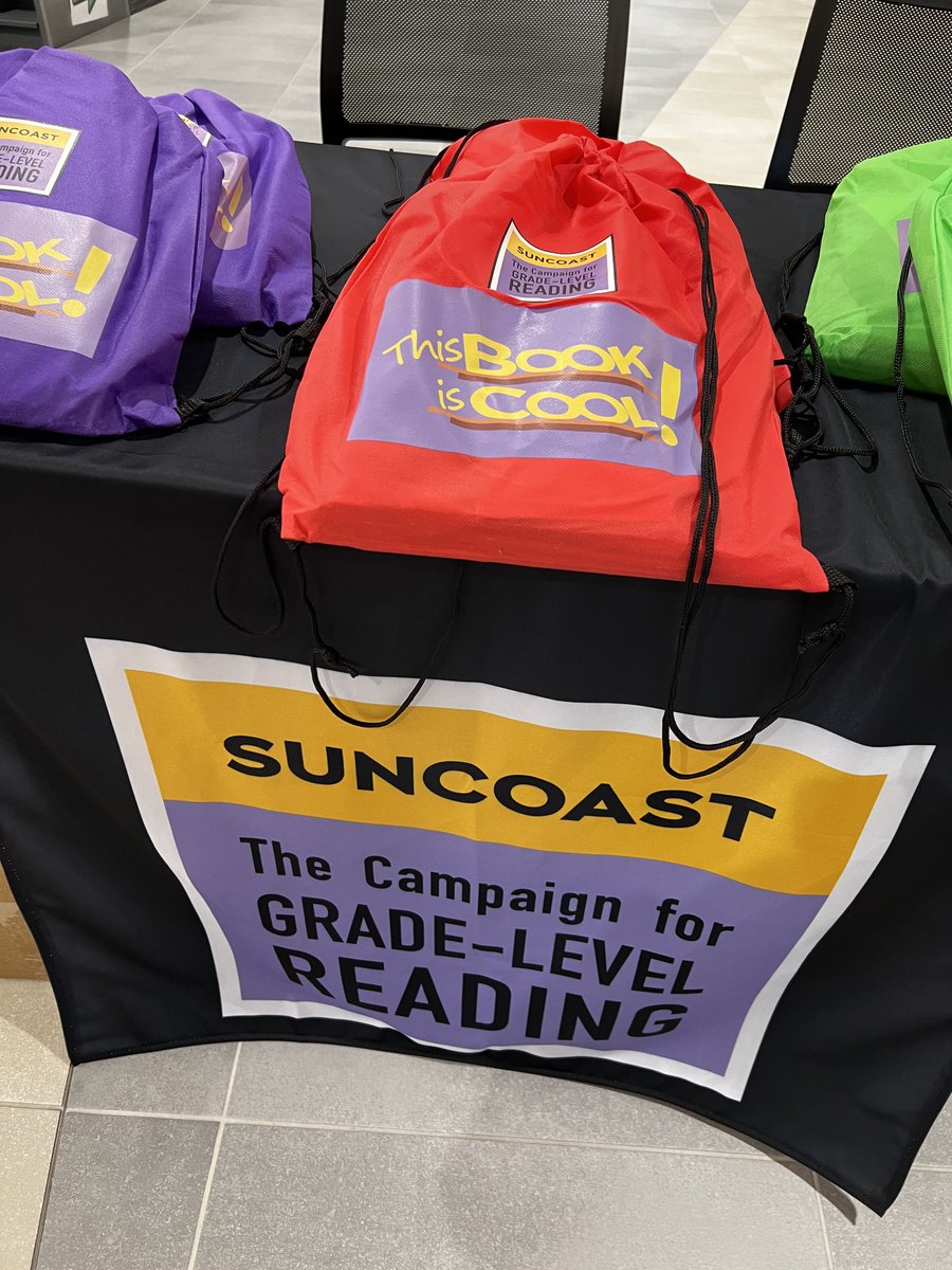 Inside the beautiful Shannon Staub Library in North Port distributing This Book is Cool books