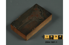 2004.1901.001 metal plate on wood block Used in a printing press to transfer an image to paper using ink v.gd/JXqp5c