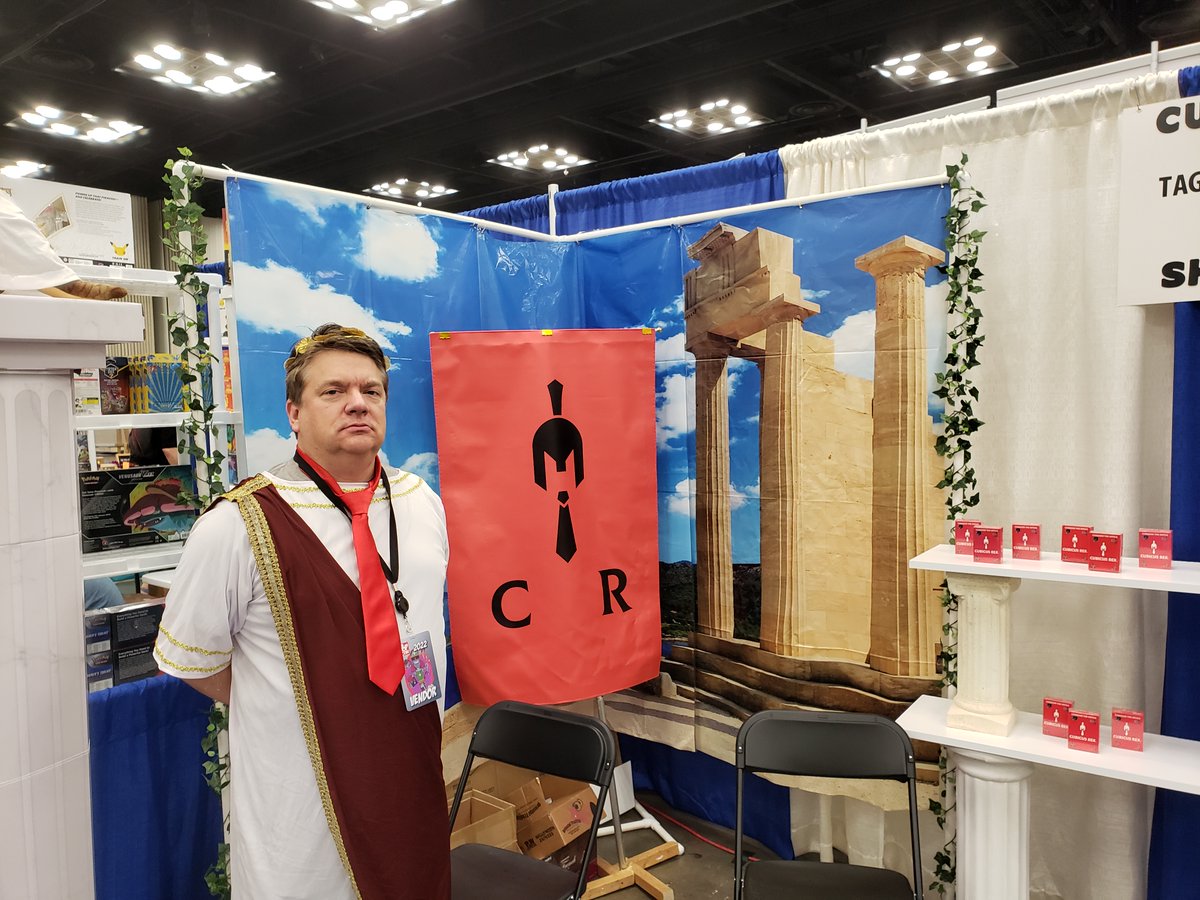 Day two at #PopCon2022 doing the v serious work of selling games. Come on over and check out Cubicus Rex - Booth 828 all day long!