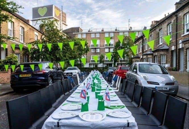 Grenfell campaigners held a Jubilee street party attended by nobody. Image shows a table set with 72 empty seats, for each of the victims in the 2017 fire.

#remembergrenfellcapitalismkilledthem