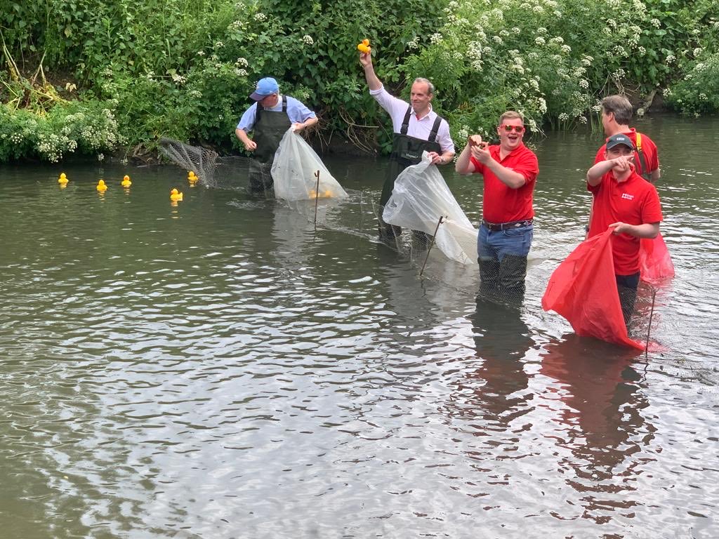 DominicRaab's tweet photo. Jubilee celebrations continued in Cobham today - from antique cars to wall climbing, and culminating in the annual duck race down the River Mole. Thanks to all those involved, especially ⁦@CobhamHeritage⁩. Fantastic to see the community come together. #platinumjubilee https://t.co/3BmfBjmpSj