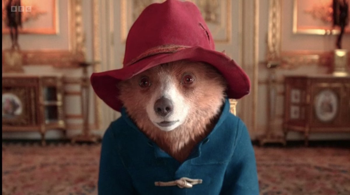 WOW. As iconic as Her Majesty’s moment during the 2012 Olympics when she met Bond… the Queen with Paddington getting a sandwich out of her famous handbag.