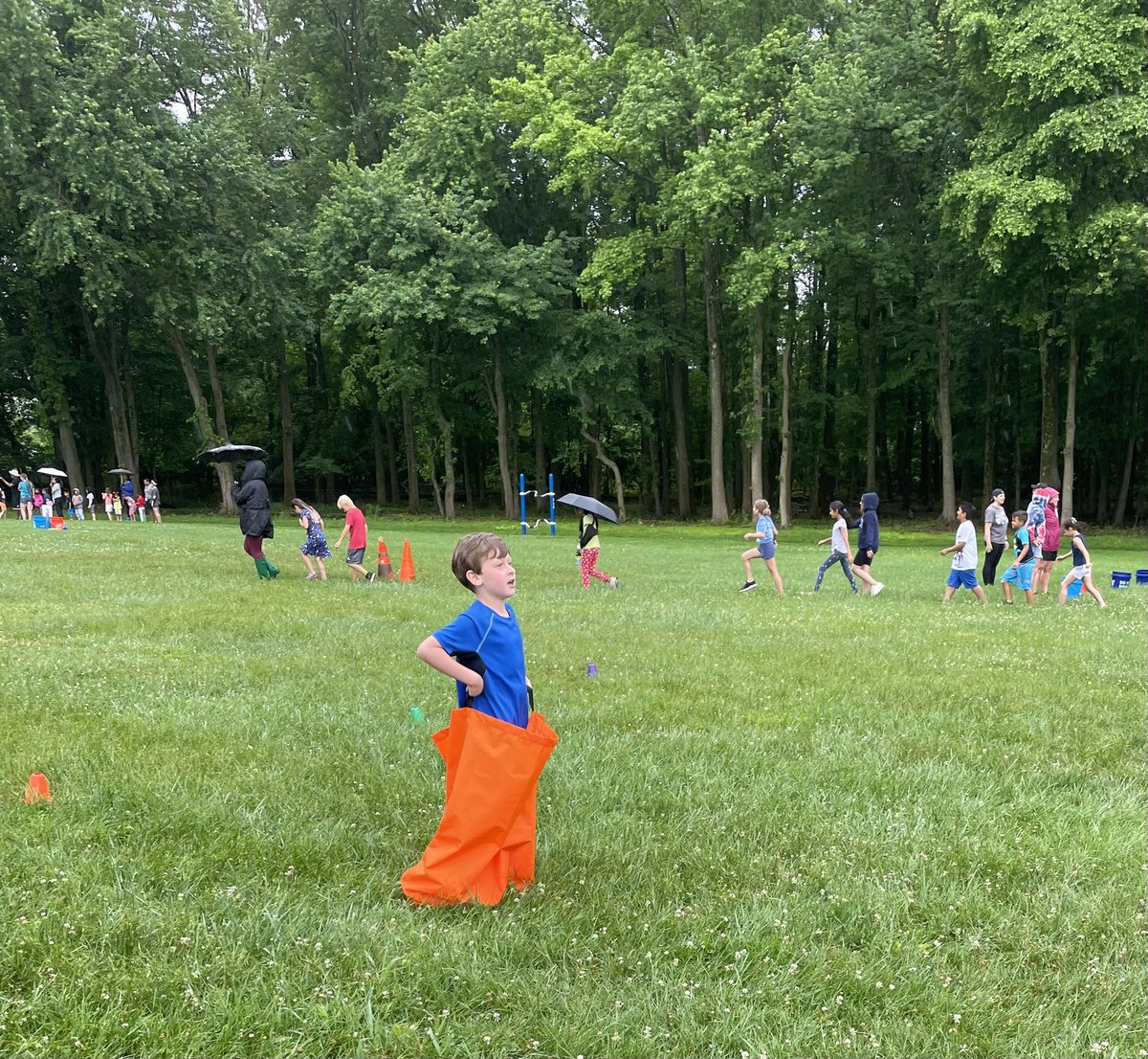 sharcivil's tweet photo. Fun times on field day! The rain added an extra special element to the excitement! #bestdayever #squishysneakers @LTPS1 @SlackwoodSchool https://t.co/CEax6Fpano