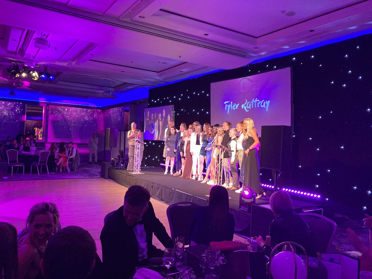 ScotWFootball's tweet photo. Val McDermid praises the “sisterhood and solidarity” at @McDermidLadies 
exemplified by the leadership of Tyler, who invites her McDermid team mates onto the stage #SWFawards https://t.co/nHWKF4lc7f