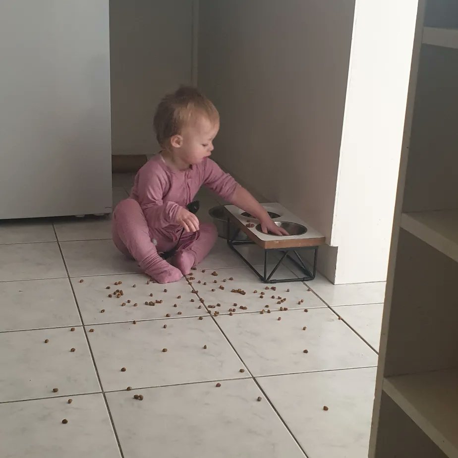 Charlotte helping "feed" Toby lol