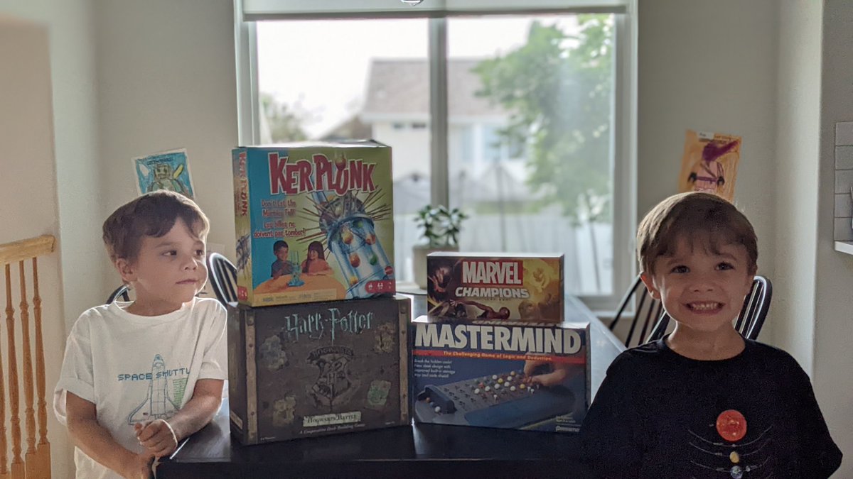 jonwesleywalton's tweet photo. I don't post my kids often on here, but they insisted on being in this picture with the choices for this month's board game bash. Player Kang for the first time with Marvel Champions and loved the challenge. #boardgamebash https://t.co/dnLAwVuTyo